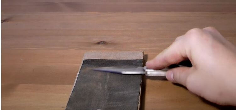 sharping a pocket knife with Sandpaper