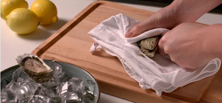 A Cook Uses a Cleaning Towel