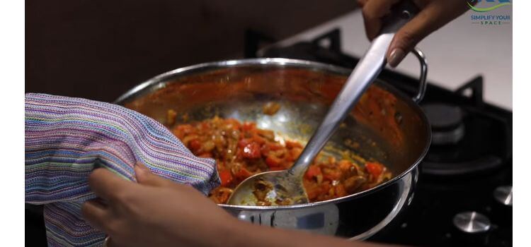 A Cook Uses a Cleaning Towel